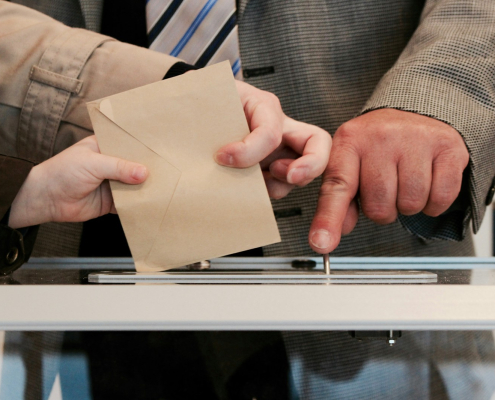 Person standing near table